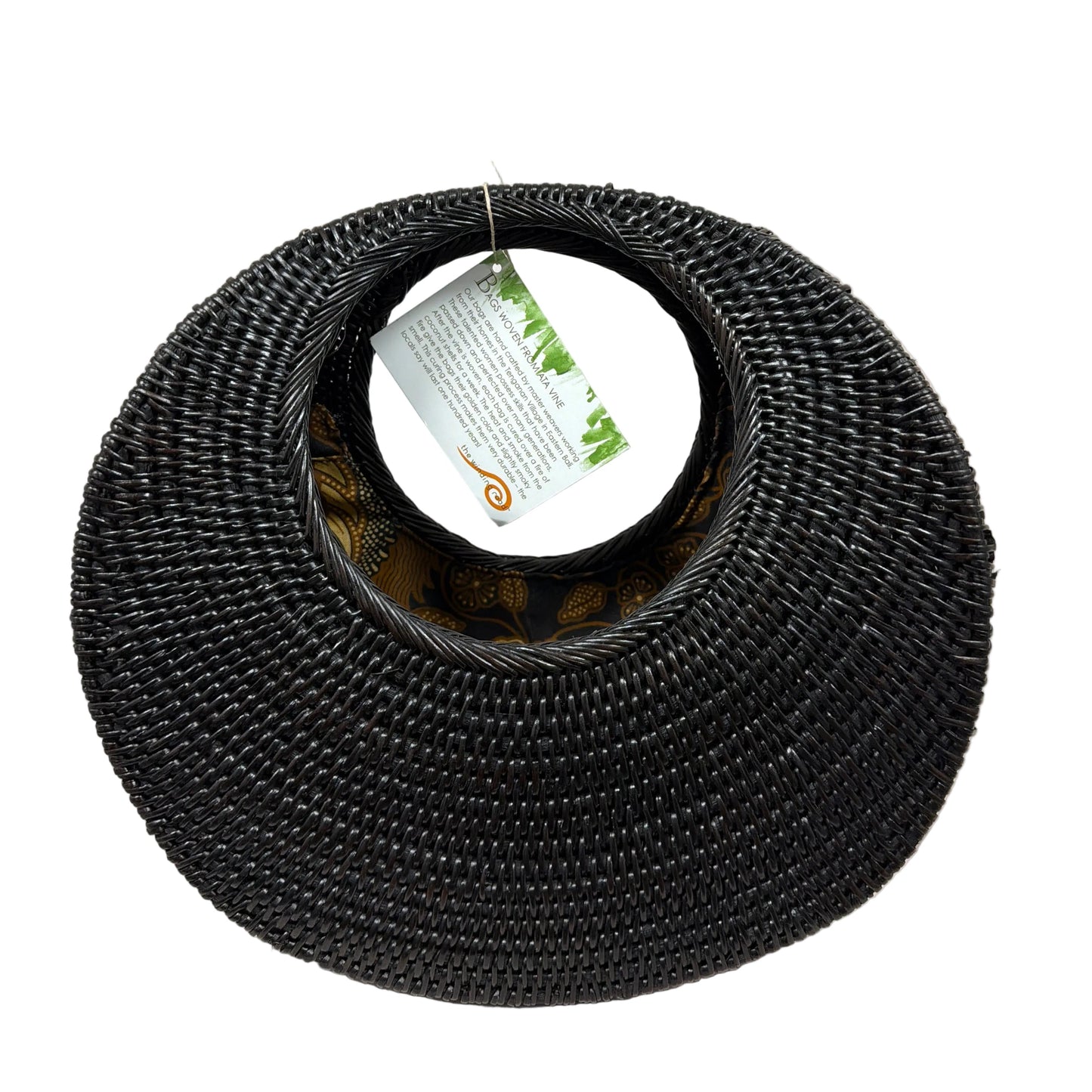 Black woven cat bed on a light beige surface
