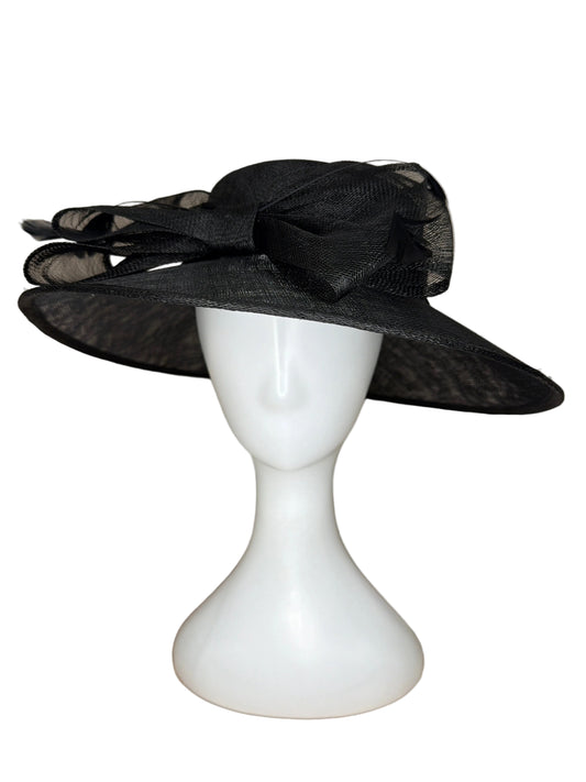 Black decorative headband on a white mannequin head against a beige background