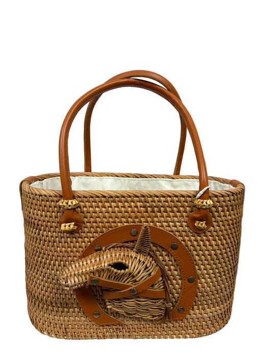 Woven handbag with leather accents on a white background