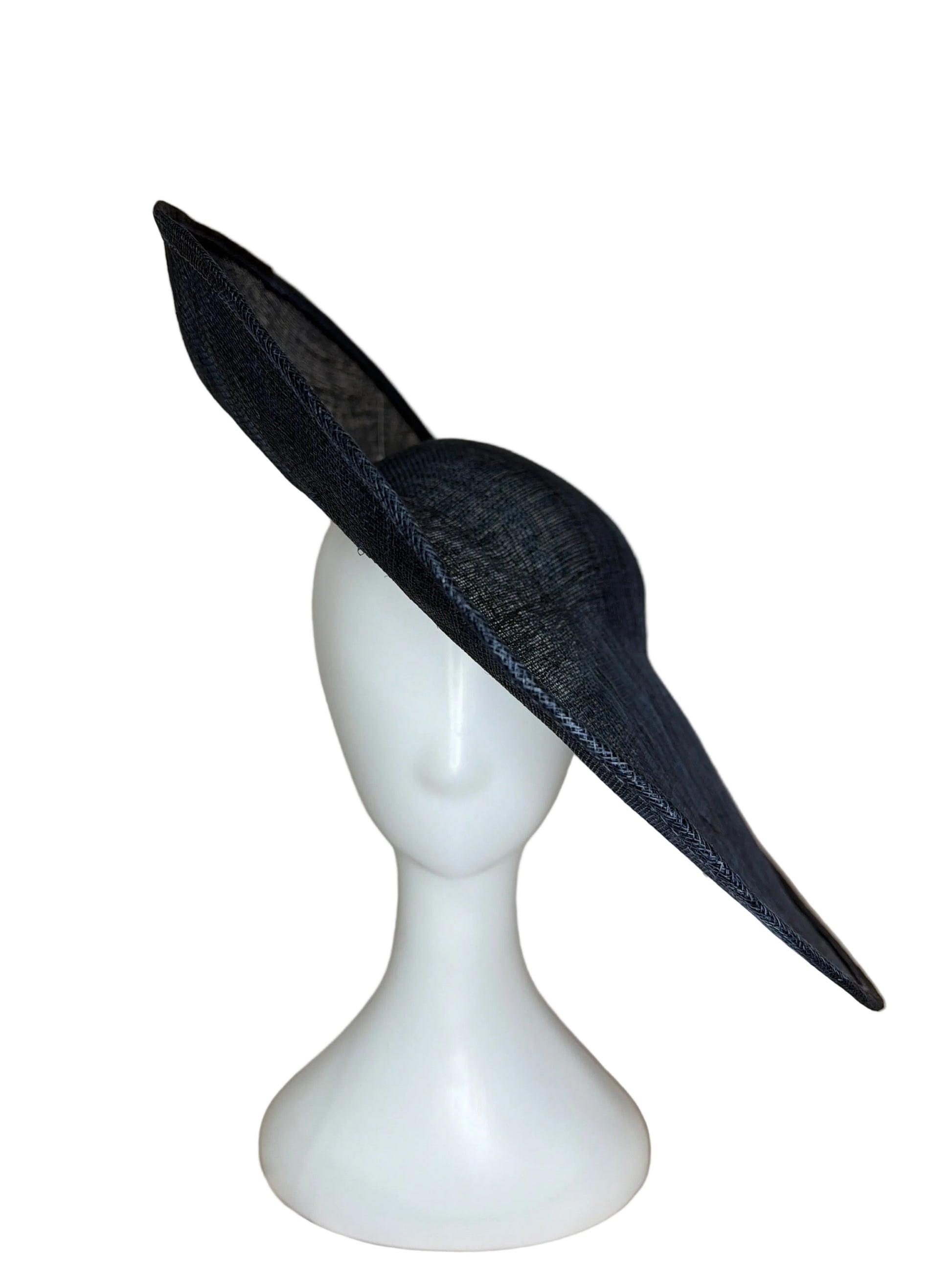 Navy wide-brimmed hat on a white mannequin head against a beige background