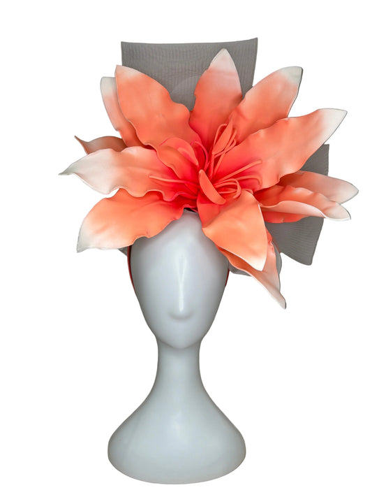 Floral headband on a mannequin head against a neutral background