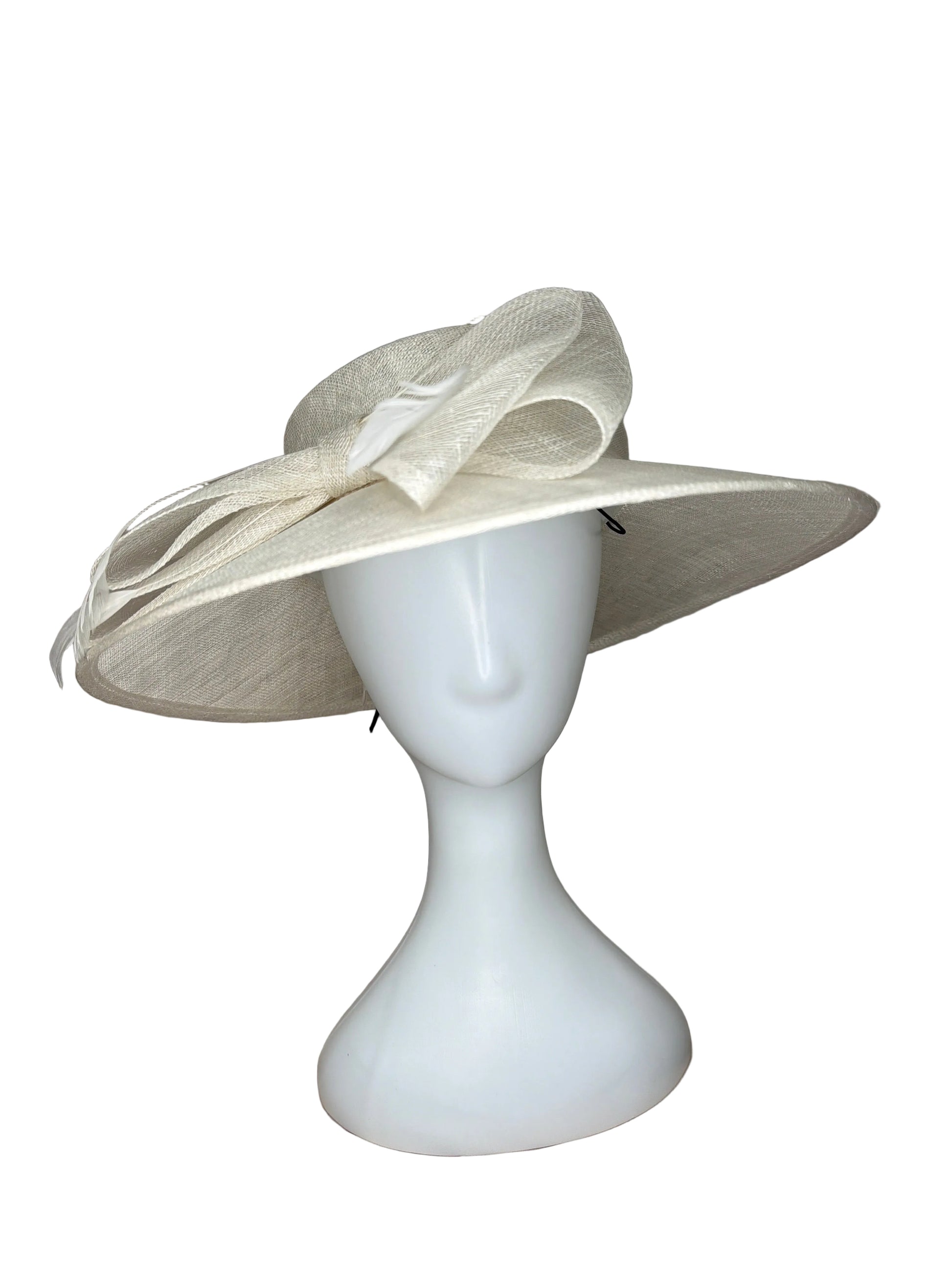White decorative bow on a beige fabric background
