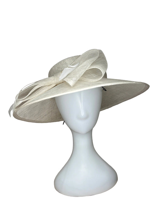 White decorative bow on a beige fabric background