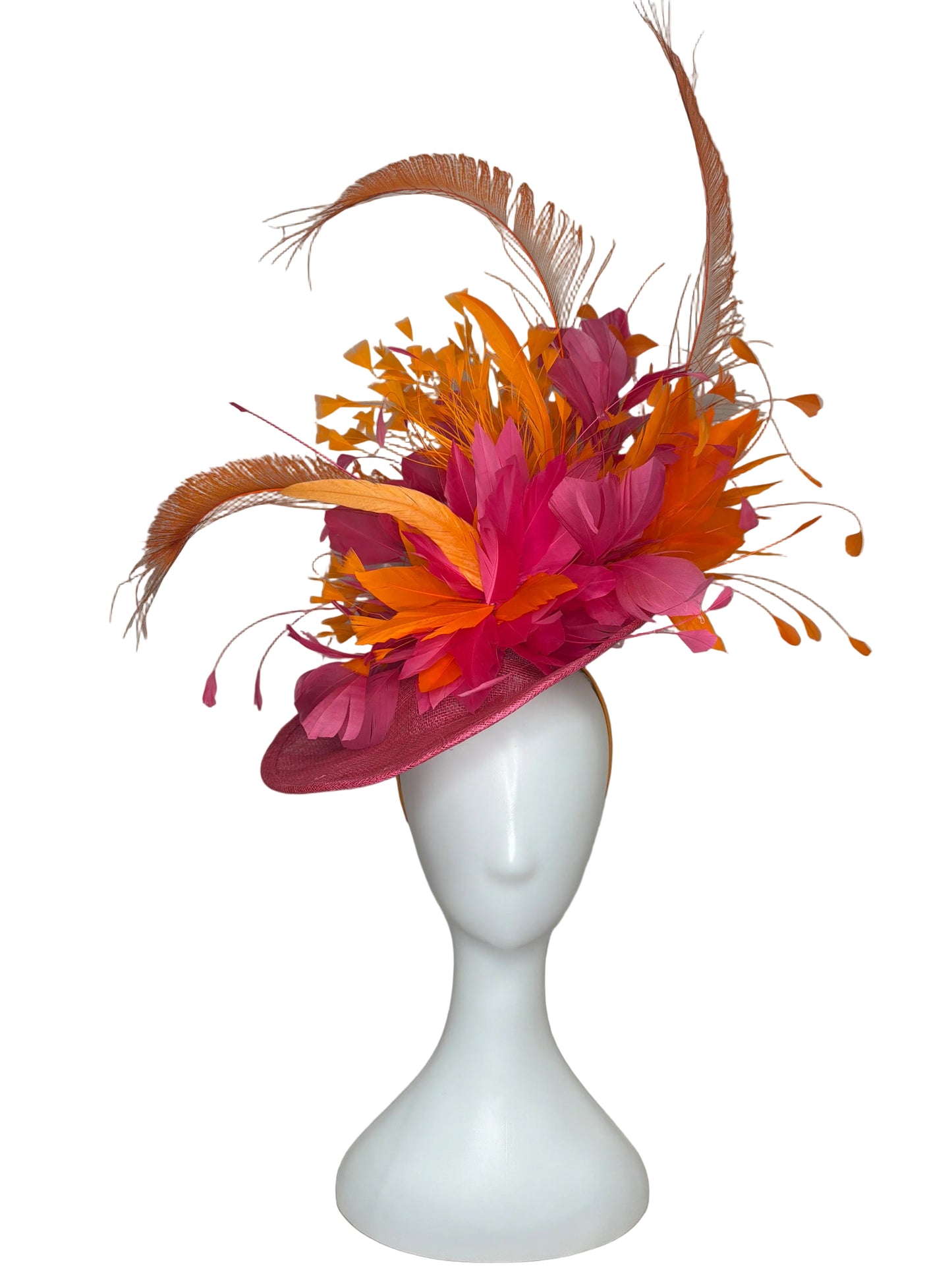 Decorative headband with pink and orange feathers on a beige background