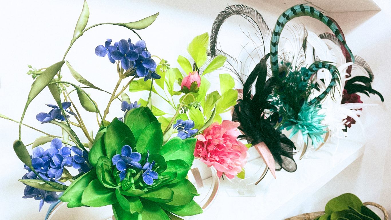 Floral and feathered headpieces on a white background