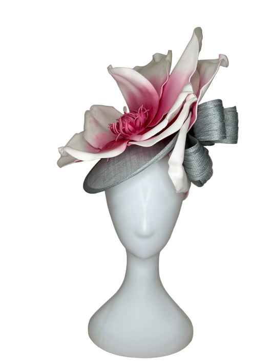 Floral headpiece on a mannequin head against a beige background